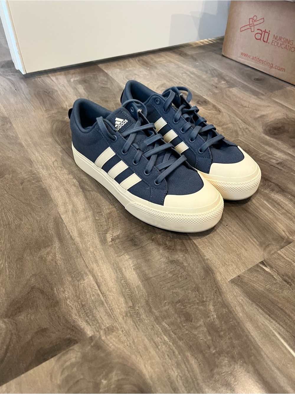 adidas women’s Navy Canvas Low-Top Sneakers with White Stripes and Toe Cap